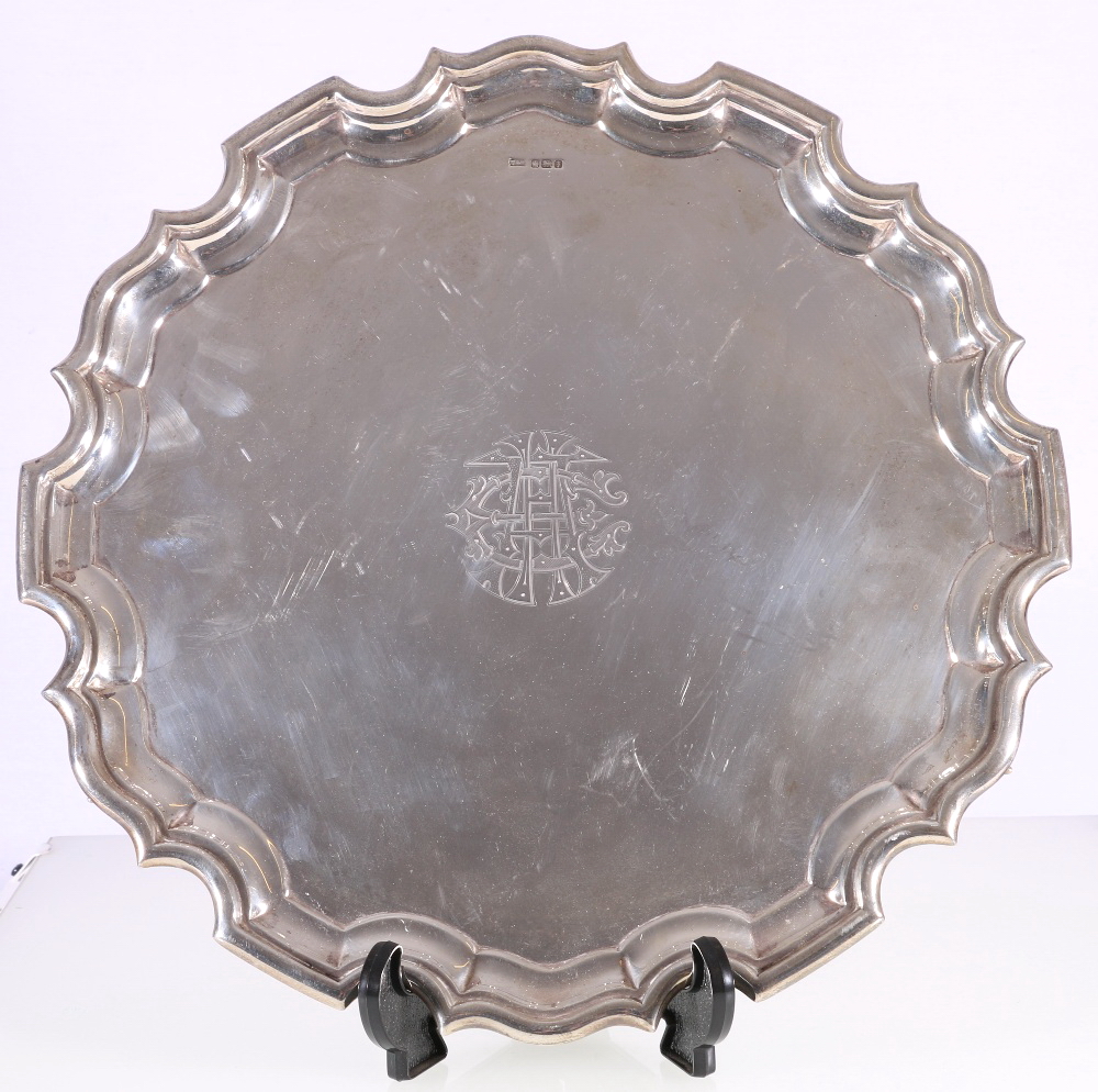 Walker & Hall silver tray, with serpentine border and engraved monogram, raised on scroll feet,