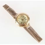 18ct gold ladies watch, with enamel Roman dial, on a 9ct gold mesh bracelet, 23g gross.