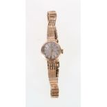 Ladies 9ct gold Girard Perregaux, with silvered baton dial and articulated strap, 17 jewel movement,