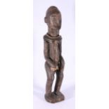 African standing male tribal figure with small beard, scarified body and face,