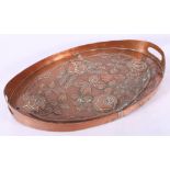 Scottish Arts & Crafts oval copper tray, embossed with entwined Glasgow style roses, 44cm.