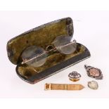 Gents gilt metal spectacles, a silver cricket medal, a heart shaped paste pendant ,