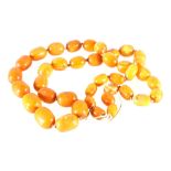 Single strand butterscotch amber necklace, the beads measuring 17mm to 25mm long, approx.