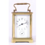 Early 20th century brass carriage clock with Arabic dial and alarm indicator,