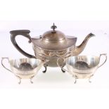 Silver three piece teaset of circular form, with ribbon and swag borders, Birmingham 1912,