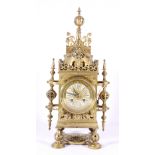 Early 20th century French brass mantel clock of pierced architectural form,