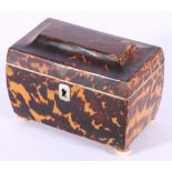 Georgian tortoiseshell tea caddy of sarcophagus form, white metal escutcheon,