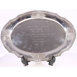 Thai oval white metal tray, with deity embossed lambrequins and engraved inscription dated 1978,