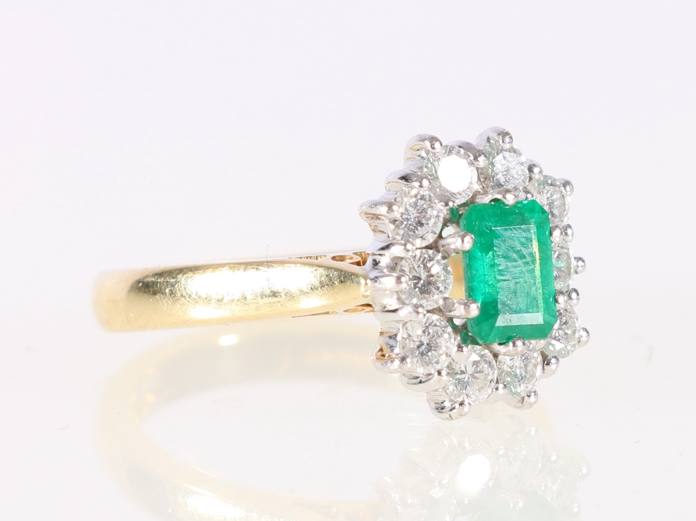 18ct yellow gold diamond and emerald ring, the emerald approximately 5.5mm x 4mm, ring size N, 6.