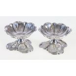 Pair of Continental white metal lily pad pedestal salts, unmarked, 90g gross, 4.5cm.