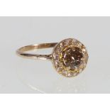 Edwardian diamond cluster ring with old cut cinnamon brilliant, approximately .