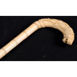 Early 20th century carved ivory walking stick, the stick ribbed as bamboo sections,