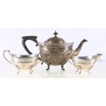 Silver three piece teaset of circular form, with ribbon and swag borders, Birmingham 1912,