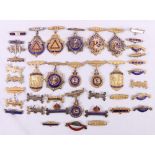 Group of eleven silver gilt enamel masonic medals, 294g, and various clasps.