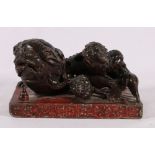 18th or early 19th century Chinese stoneware model of a shi shi dog and puppy,