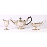 Edwardian silver three piece teaset of boat shape with wavy rim, Chester 1904, 640g, Maker JDWD.