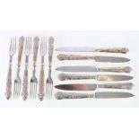 Silver handled set of twelve fruit knives and forks, the blades covered with foliate decoration,