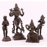 Group of four Indian bronze figures of Krishna playing a lute,