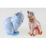 A Herend porcelain model of a cat decorated in blue and another in red, printed and impressed marks,