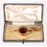 15ct yellow gold brooch set with faceted oval citrine, 6.1g, 4cm long.