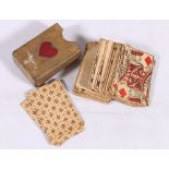 An early miniature set of playing cards possibly English, contained in a vellum (?) sleeve,