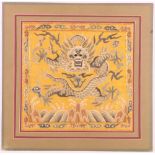 Early 20th century Chinese rank badge, Dragon, on a yellow ground, waves and a cloud border,