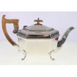 George V silver teapot of octagonal form raised on paw supports, Sheffield 1933,