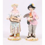 Pair of 19th century Dresden porcelain figures of a Hurdy-gurdy player and a gentleman holding a