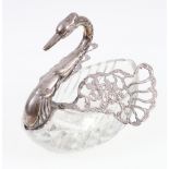 Silver and cut glass dish in the form of a swan with articulated wings. 12.