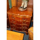 Mahogany serpentine chest of drawers with brushing slide raised on bracket feet.