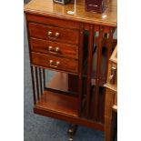 Mahogany and inlaid revolving bookcase, 91cm high.