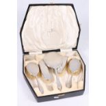 George V silver five piece vanity brush set. Sheffield 1930. Walker & Hall. cased.