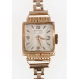 18ct gold cased ladies Mithra wristwatch on 9ct gold bracelet.