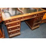 Oak pedestal desk. 137cm wide CONDITION REPORT: Leather skiver scratched and dented.