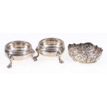 Pair of George IV silver salts raised on three supports.