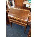 Mahogany and inlaid bureau raised on tapering supports, 68cm wide.