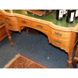 Oak writing table inset with leather skiver.