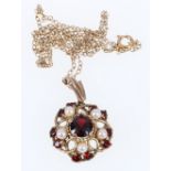 9ct gold garnet and pearl pendant on chain. 6.