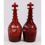 Pair of Bohemian ruby glass decanters,