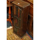 Reproduction faux book cabinet.