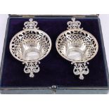 Pair of Edward VII silver bon bon dishes with ornate handles and pierced body. Birmingham 1901.