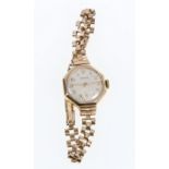 9ct gold cased ladies Marvin wristwatch on plated bracelet.