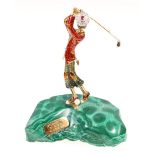 18ct gold and enamelled model of a golfer poised at the top of his swing,