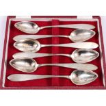 Set of six white metal grapefruit spoons, in fitted case,