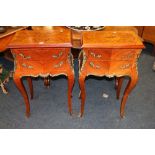 Pair of French kingwood bombe stands with metal ornamentation and sabots. 87 cm high.