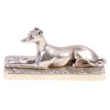 White metal desk paperweight modelled as a seated greyhound.