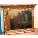 Arts & Crafts embossed copper overmantel mirror, the cornice inscribed 'East or West Home's Best',