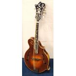 Gordon Ross mandolin with mother of pearl inlay and label dated 2014, 72cm long.