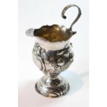 Silver baluster cream jug with embossed flowers and fruit and a scroll handle, by Charles Hougham,