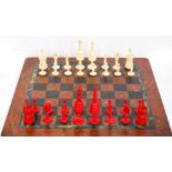 Stained ivory chess set, the King measuring 10cm high, and a marble chess board, 41cm square.